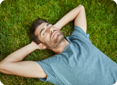 portrait-young-mature-good-looking-caucasian-man-blue-shirt-peaceful-lying-grass-with-yes-closed